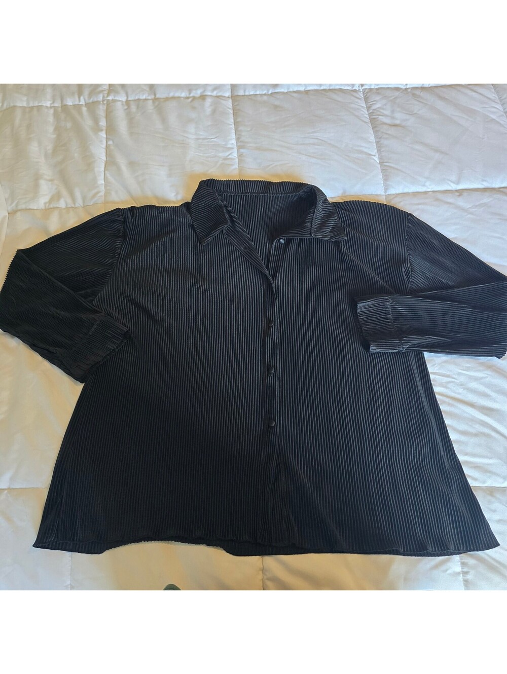 Black pleated button-front blouse